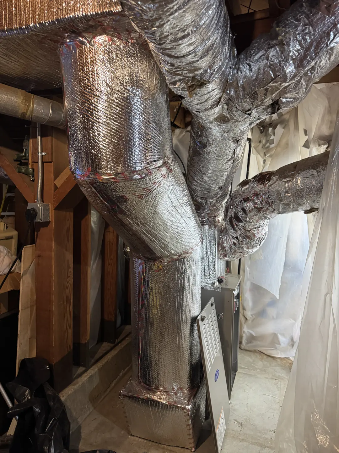 Reflective insulated supply trunk transitioning into multiple flex branches in a West Los Angeles attic-space duct retrofit